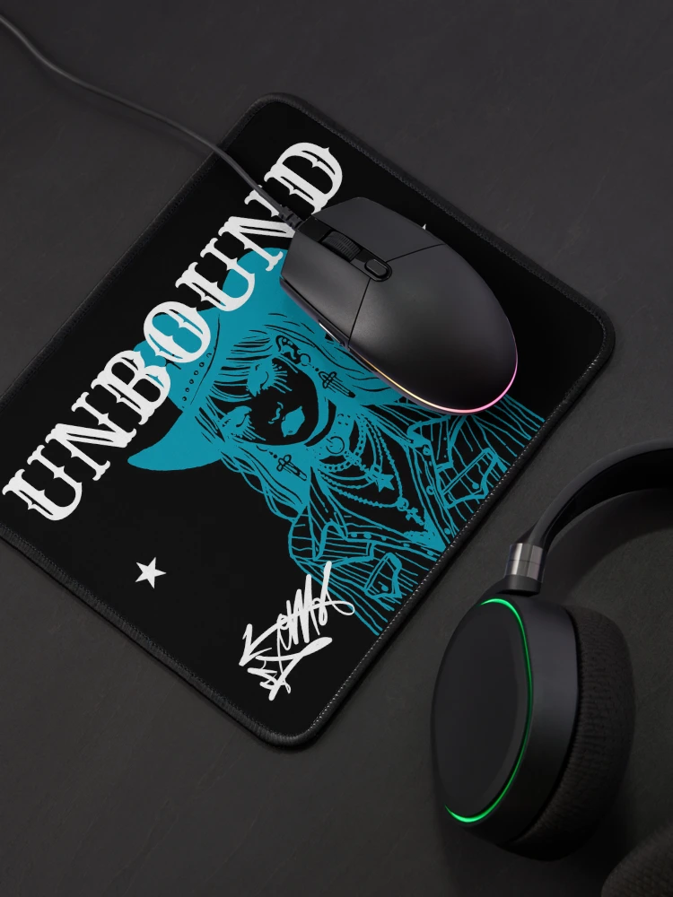 Unbound branded gaming mouse pad product mockup by CJN Digital Solutions, featuring a teal cowboy skull illustration and script signature, styled on a desk with a gaming mouse and headphones
